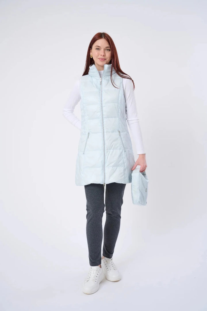 Person wearing a light blue puffer vest over a white shirt on a white background