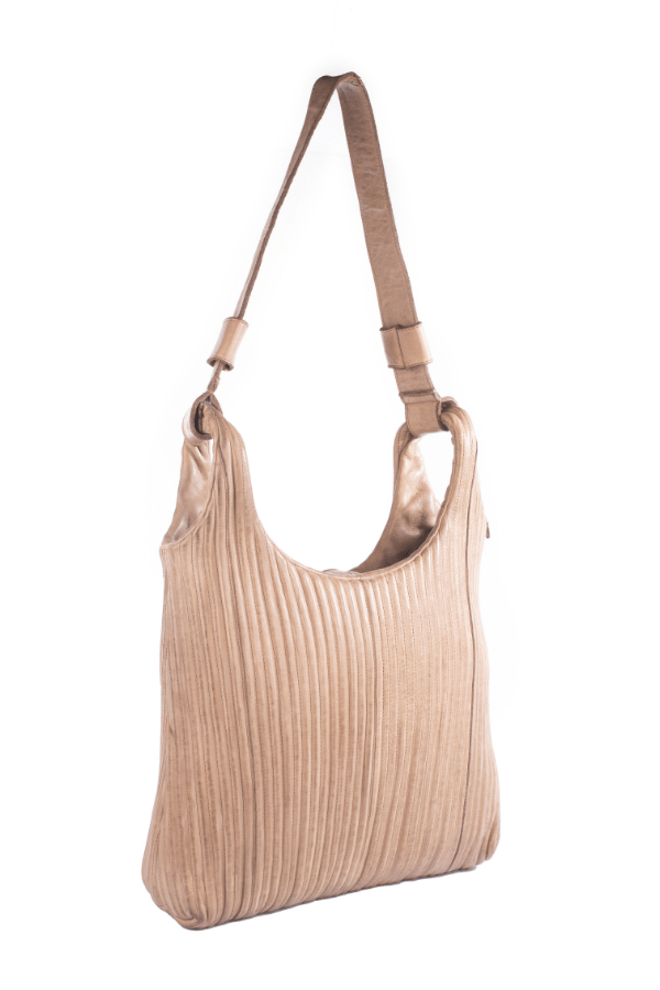 Beige ribbed handbag with a strap on a white background