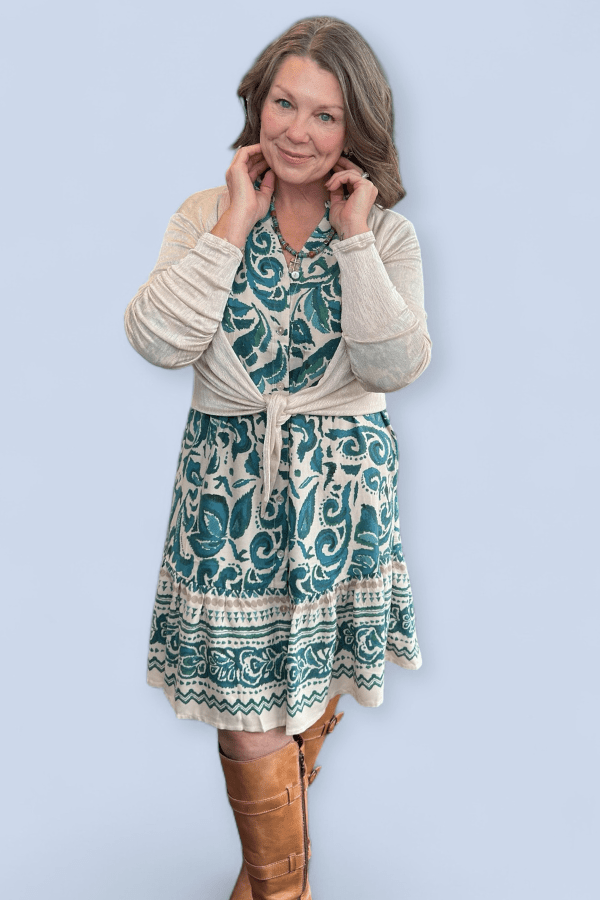 Woman wearing a blue knee length dress.