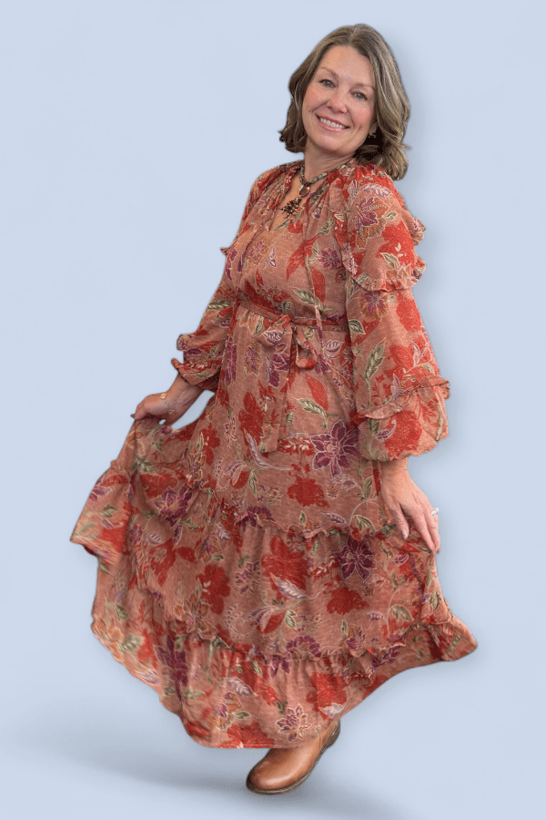 Woman wearing a floral dress on a light blue background