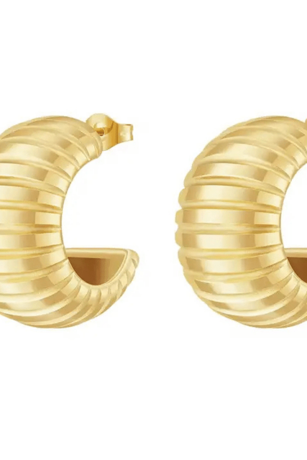 Gold hoop earrings on a white background