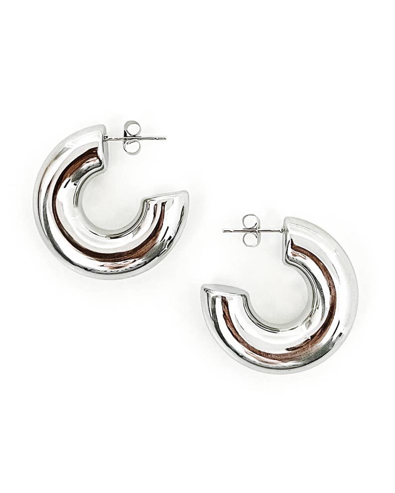 Silver hoop earrings on a white background