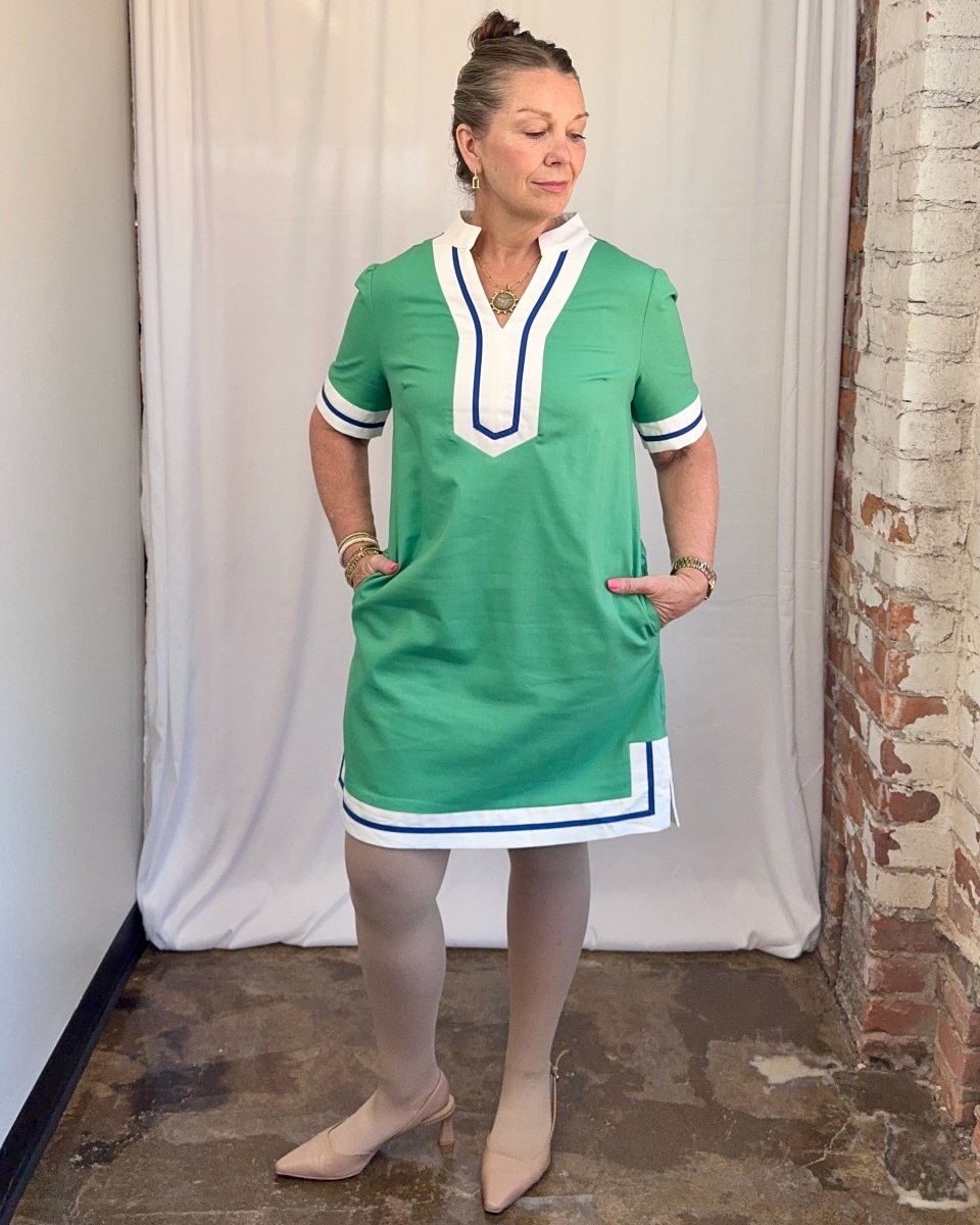 Carole Christian Contrast Trim V-Neck Shift Dress in Green — front view with hands in pockets showing split V-neckline and white navy contrast trim, model wearing Small, Modish Maven Boutique