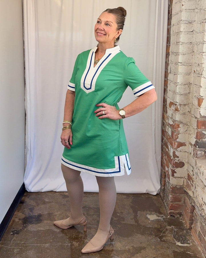 Carole Christian Contrast Trim V-Neck Shift Dress in Green — side view hand on hip showing relaxed shift silhouette and contrast sleeve cuffs, model wearing Small, Modish Maven Boutique