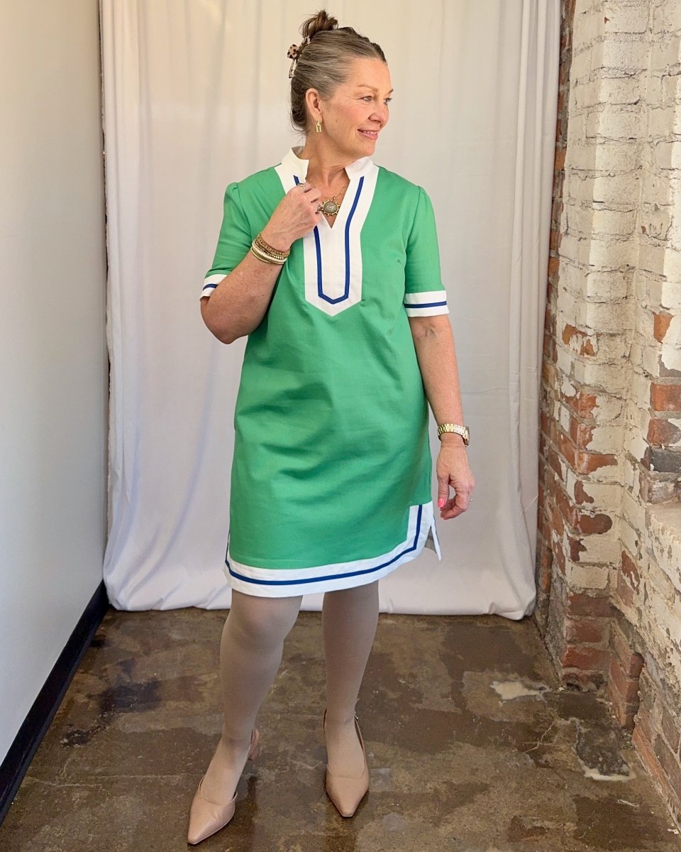Carole Christian Contrast Trim V-Neck Shift Dress in Green — front view hand at neckline showing split V-neck with white and navy contrast placket detail, model wearing Small, Modish Maven Boutique