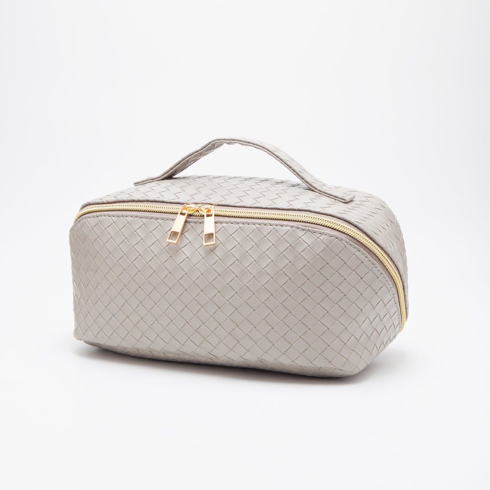 Gray woven cosmetic bag with gold zipper on a white background