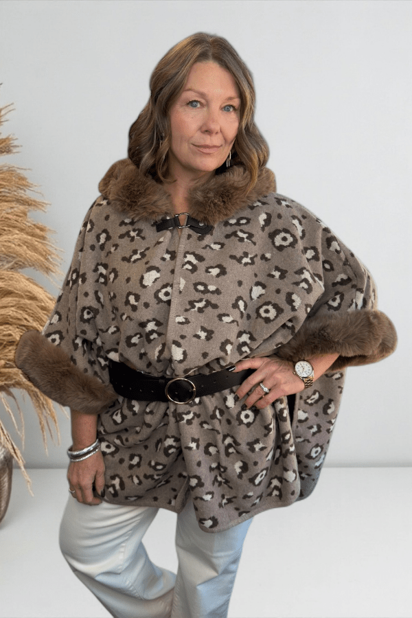 Close-up of plush faux fur texture on leopard print hooded cape.