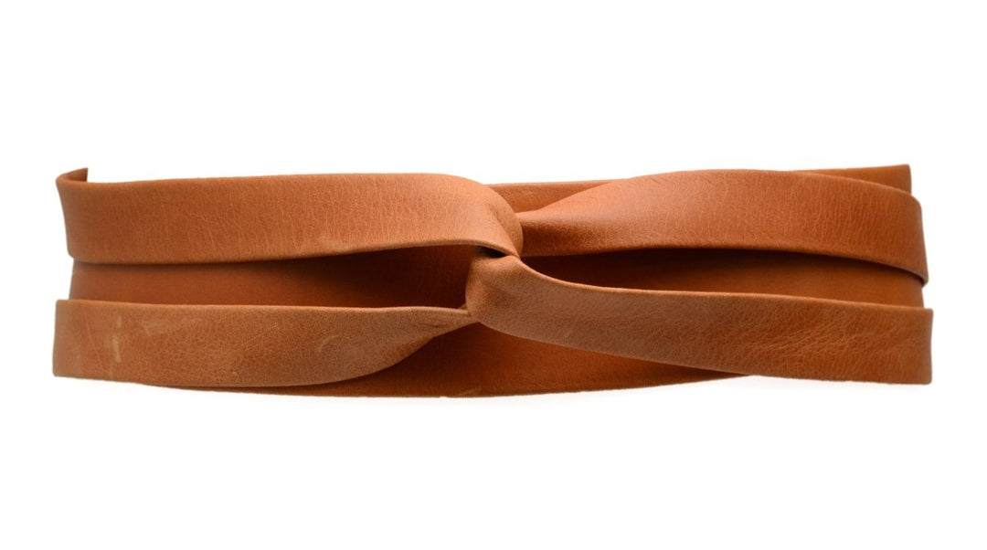Brown leather belt with a knot on a white background