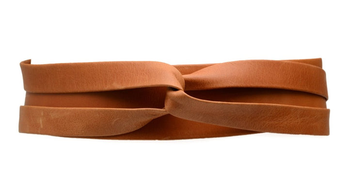 Brown leather belt with a knot on a white background