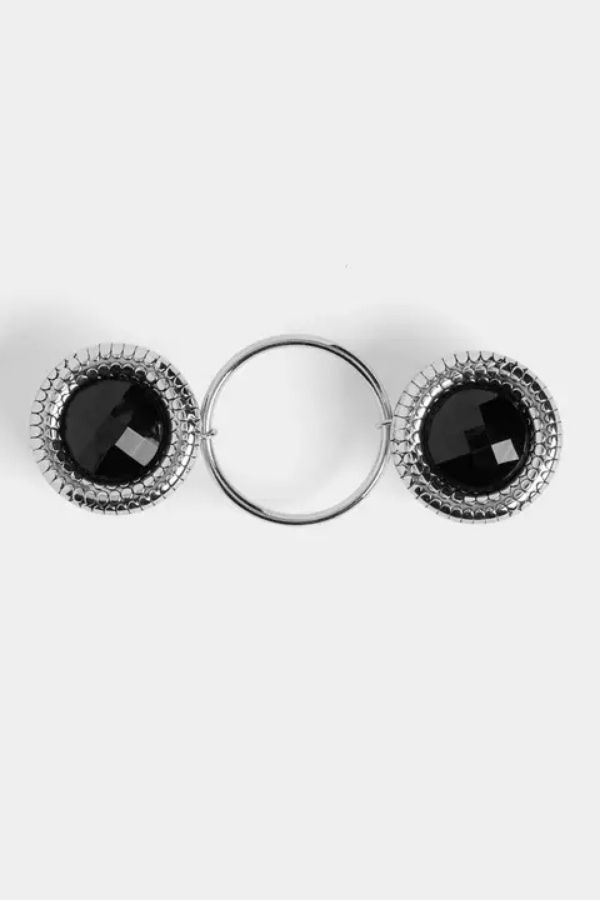 Fashion fastener with black gemstones on a white background