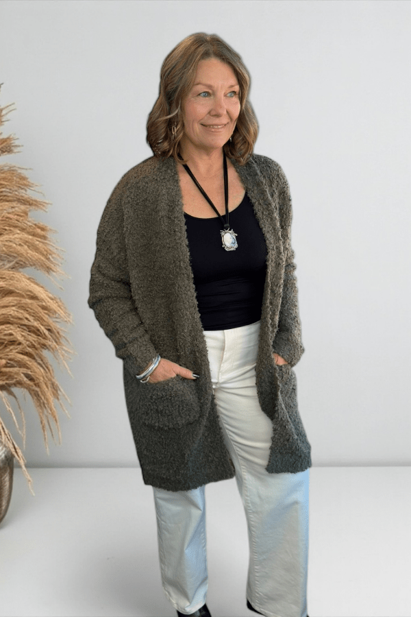 Olive cozy longline cardigan styled with casual everyday outfit.