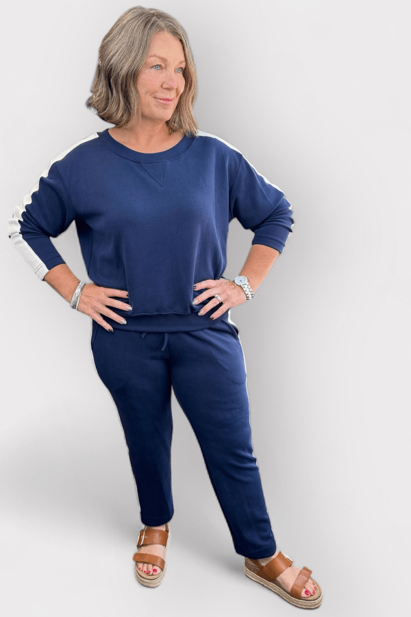 Woman wearing a blue outfit with a white background