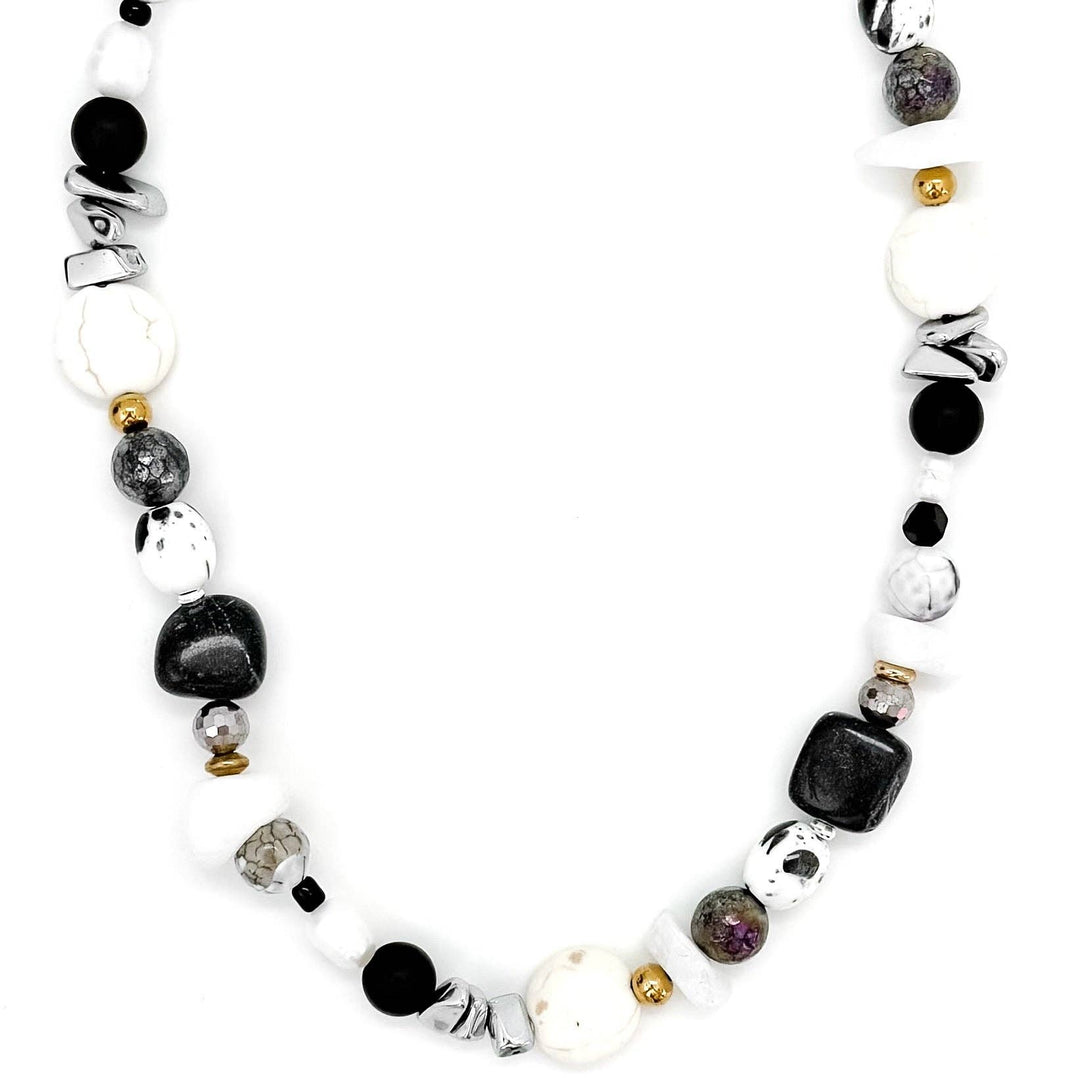 Necklace with various beads on a white background