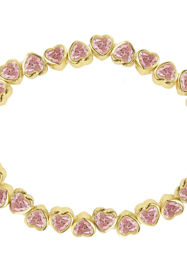 Close up detail of the pink heart bracelet.