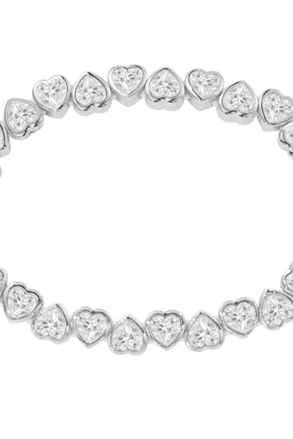 Close up detail of the silver heart bracelet.