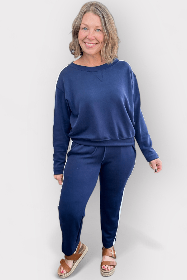 Woman wearing a blue outfit against a white background