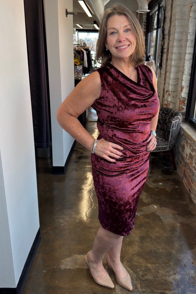 Alora Crushed Velvet Cowl Dress in Wine — side angle on model showing sleeveless cut and mid-length hem