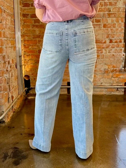Dear John Denim Audrey Wide Leg Jeans in Zurie wash, high-rise waist with patch back pockets and wide leg silhouette, back view on model
