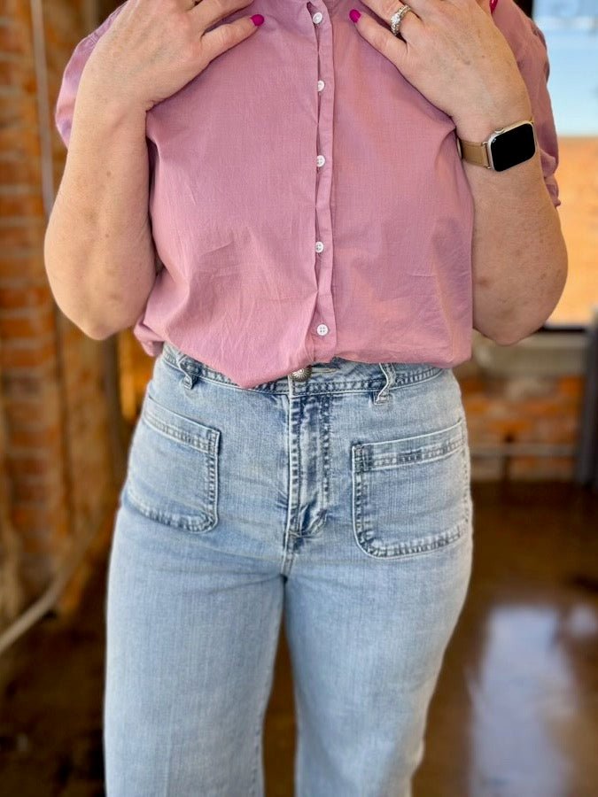 Close-up of Dear John Denim Audrey Wide Leg Jeans in Zurie wash, patch front pockets and high-rise waistband with button fly detail
