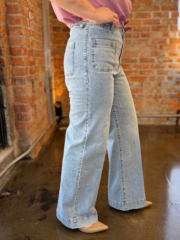 Dear John Denim Audrey Wide Leg Jeans in Zurie wash, high-rise silhouette with wide leg and patch pocket, side view on model
