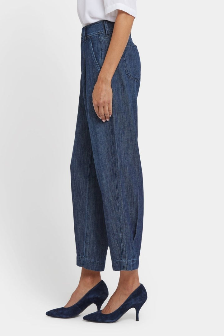 Balloon Trouser Jeans With Pleats in La Mer — side view showing curved leg silhouette and slash pocket