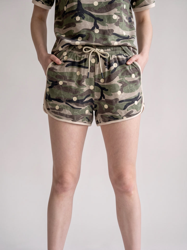 Carole Christian Camo Polka Dot Tee &amp; Shorts Set in Camo — close-up of drawstring waist shorts with polka dot print, pockets, and blush contrast hem trim, Modish Maven Boutique