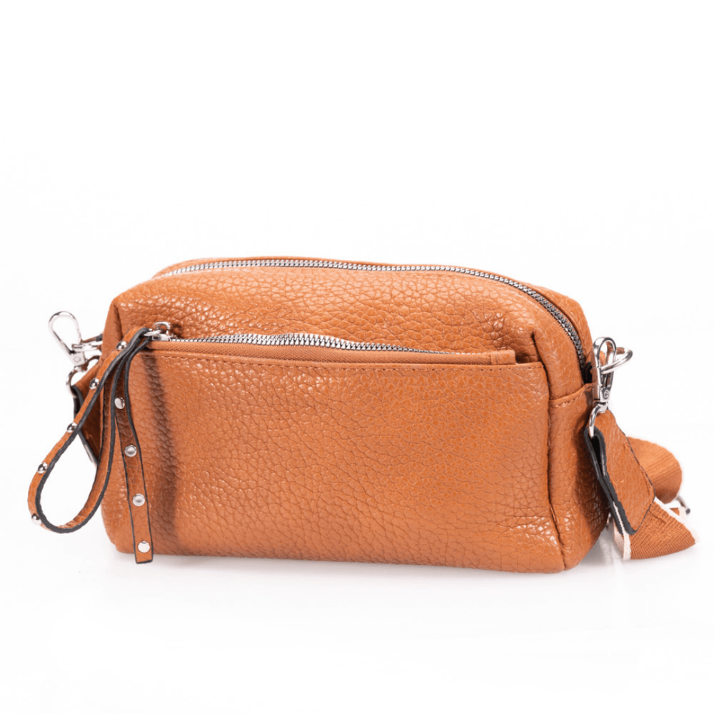 Camel pebbled leather bag on white background.