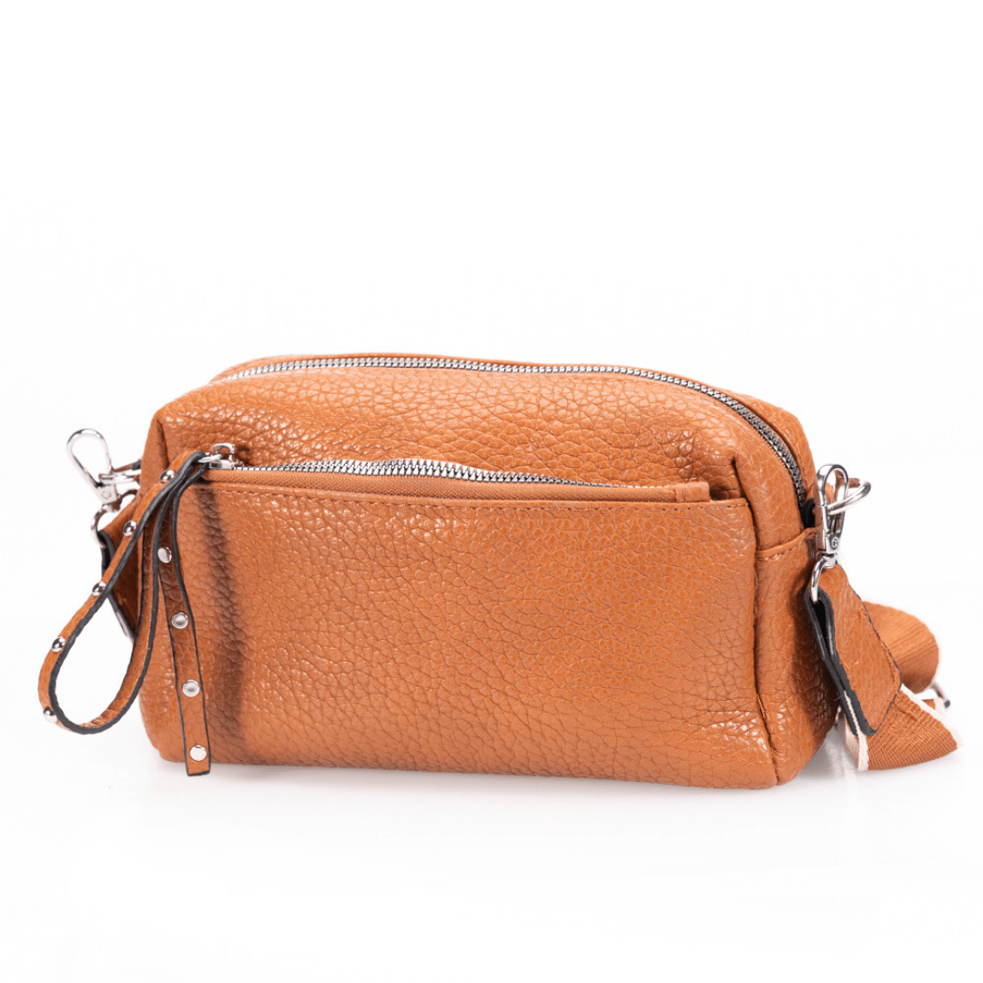 Camel pebbled leather bag on white background.