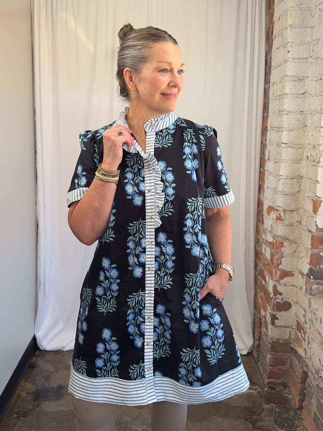 Carole Christian Floral Block Print Ruffle Placket Shirt Dress in Black/Blue, puff sleeves and stripe ruffle collar, three-quarter view on model