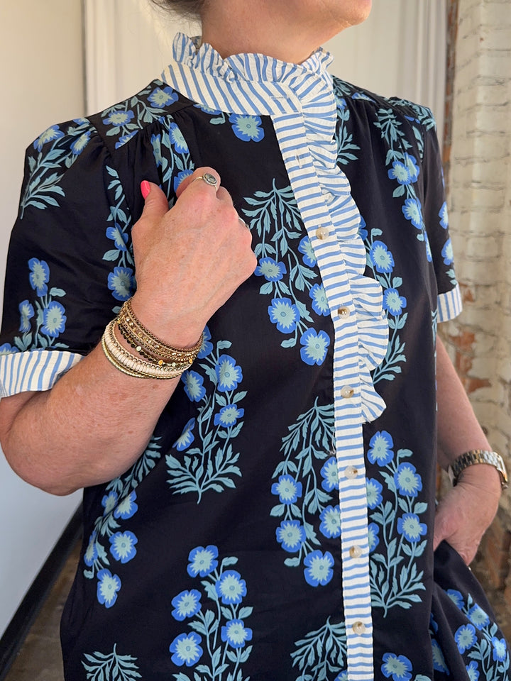 Close-up of Carole Christian Floral Block Print Shirt Dress stripe ruffle placket, gold button closure, and blue floral cotton print