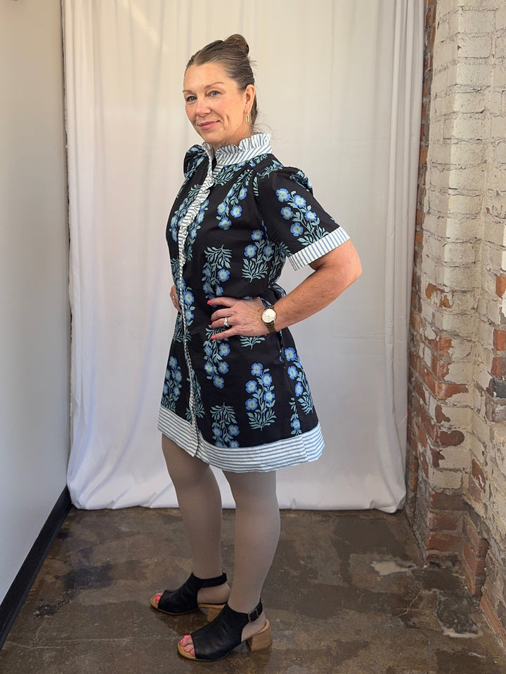 Carole Christian Floral Block Print Ruffle Placket Shirt Dress in Black/Blue, short puff sleeves and stripe cuffs, side view on model