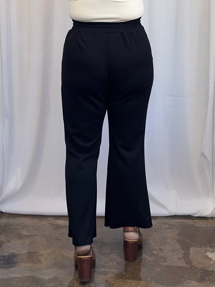 Scuba Modal Split-Collar Wide-Leg Set in Black, open V-neck collar and 3/4 cuffed sleeves styled with statement belt, front view on model