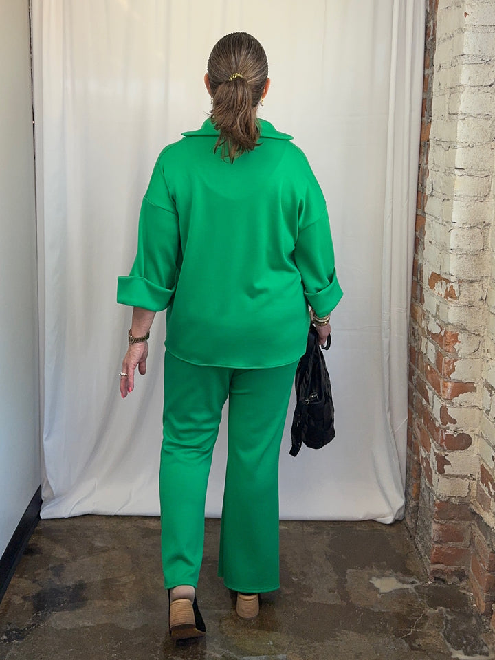 Carole Christian Scuba Modal Split-Collar Wide-Leg Set in Kelly Green, full-length rear view showing wide-leg pant and high-low hem top on model