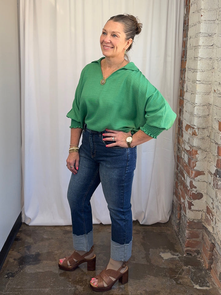 Carole Christian Relaxed Collar V-Neck Smocked Sleeve Blouse in Kelly Green, relaxed dolman fit with smocked 3/4 sleeves, quarter-turn view on model