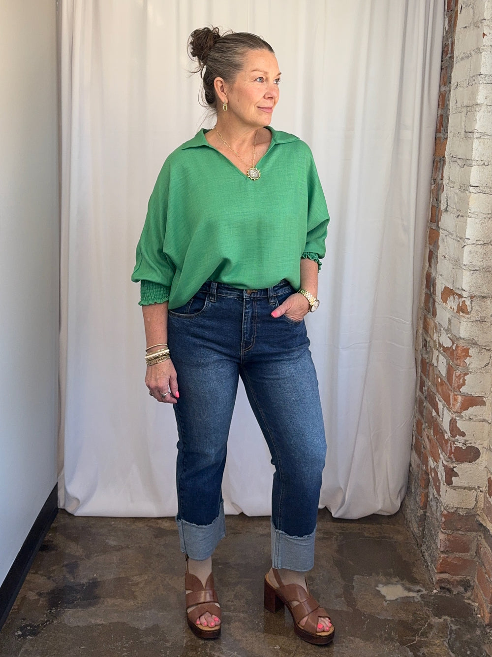 Carole Christian Relaxed Collar V-Neck Smocked Sleeve Blouse in Kelly Green, open V-neck collar and dolman sleeves, front view on model