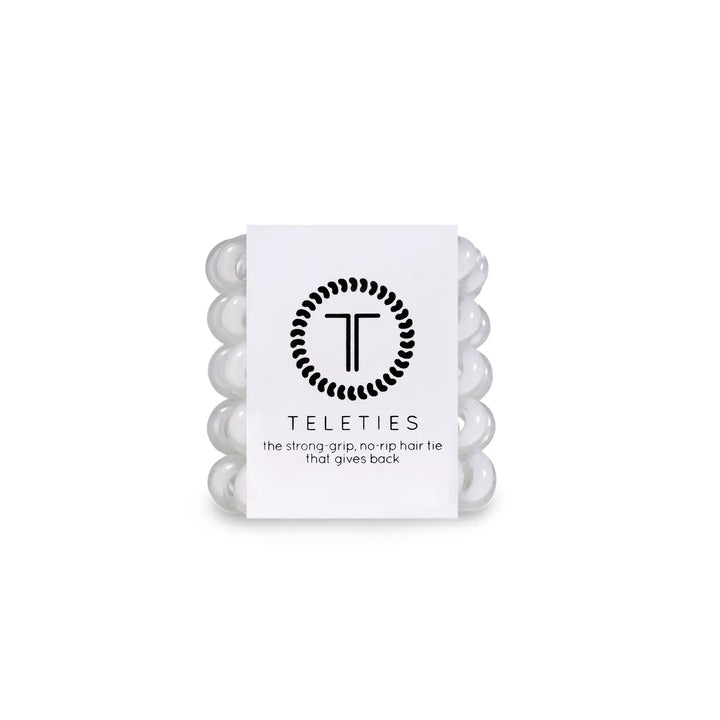 A package of TELETIES tiny white hair ties designed for kids and fine hair.