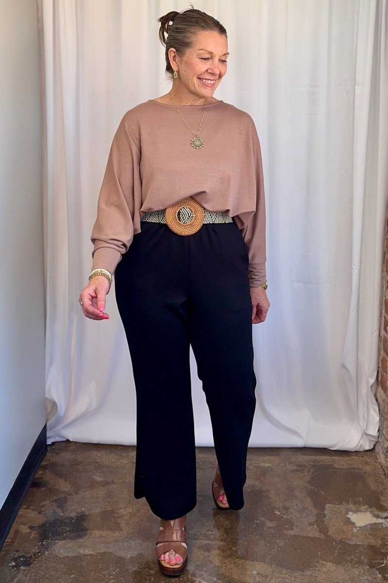 Cuffed Dolman Split Hem Relaxed Top in Taupe by Carole Christian — full body front view, relaxed oversized fit styled with wide-leg trousers and platform sandals
