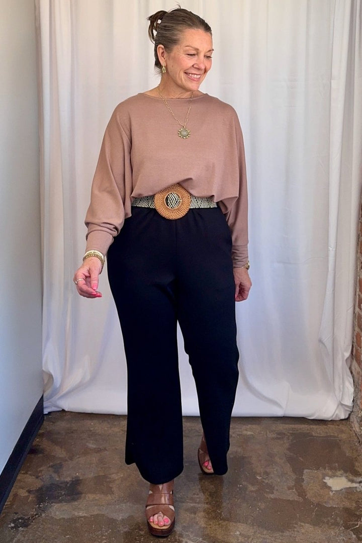 Cuffed Dolman Split Hem Relaxed Top in Taupe by Carole Christian — full body front view, relaxed oversized fit styled with wide-leg trousers and platform sandals
