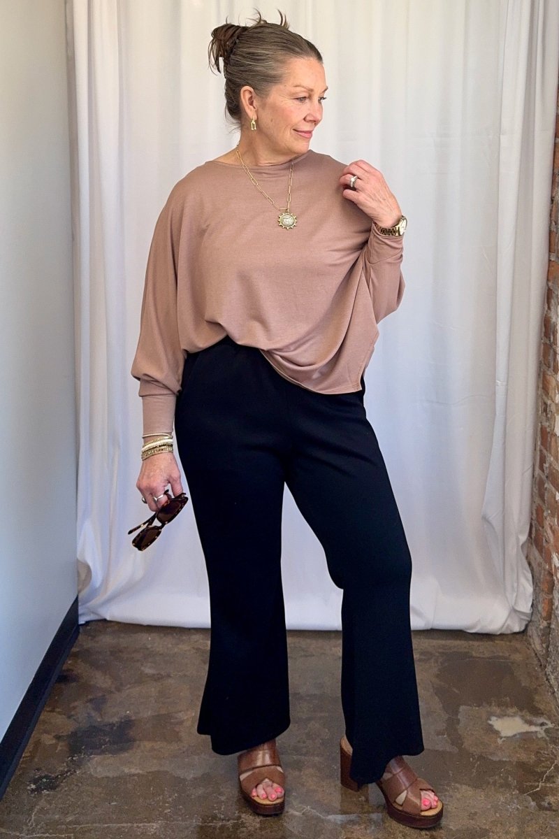 Cuffed Dolman Split Hem Relaxed Top in Taupe by Carole Christian — close-up styled with woven belt, showing tucked silhouette and fabric drape