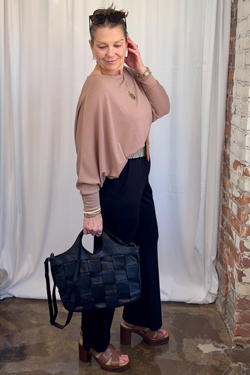 Cuffed Dolman Split Hem Relaxed Top in Taupe by Carole Christian — full body styled outfit with woven belt and wide-leg black pants