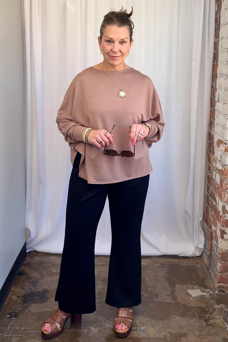 Cuffed Dolman Split Hem Relaxed Top in Taupe by Carole Christian — close-up front view showing dolman sleeve drape and cuffed 3/4 sleeve detail