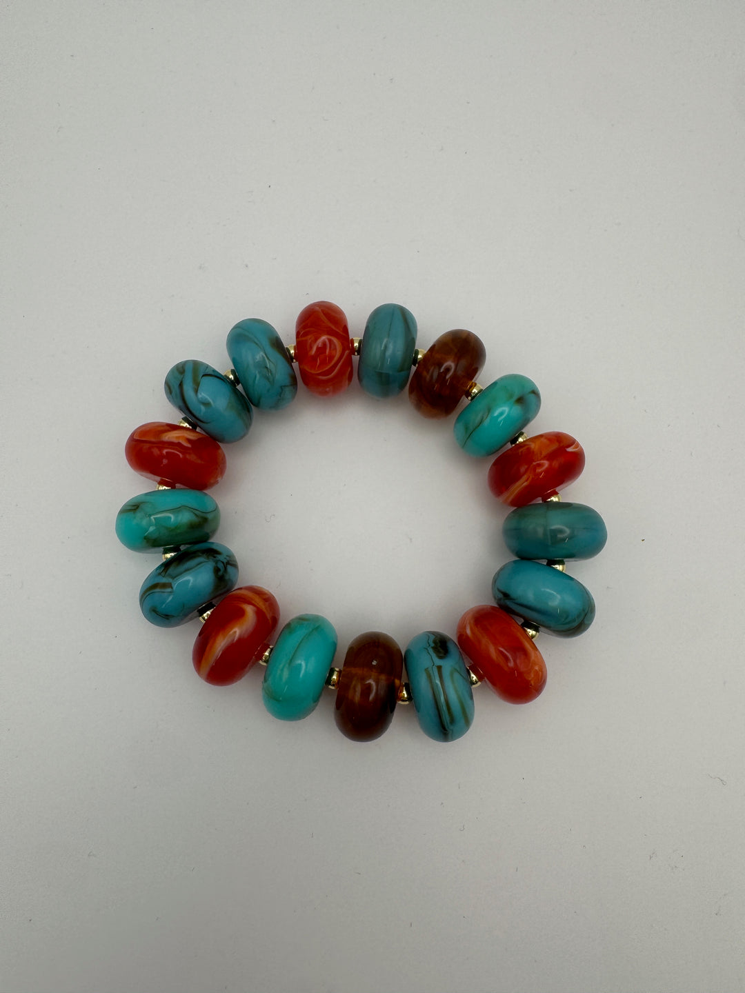 Current Mood Chunky Bracelet in Sunset — flat lay showing circular shape and gold-tone spacers