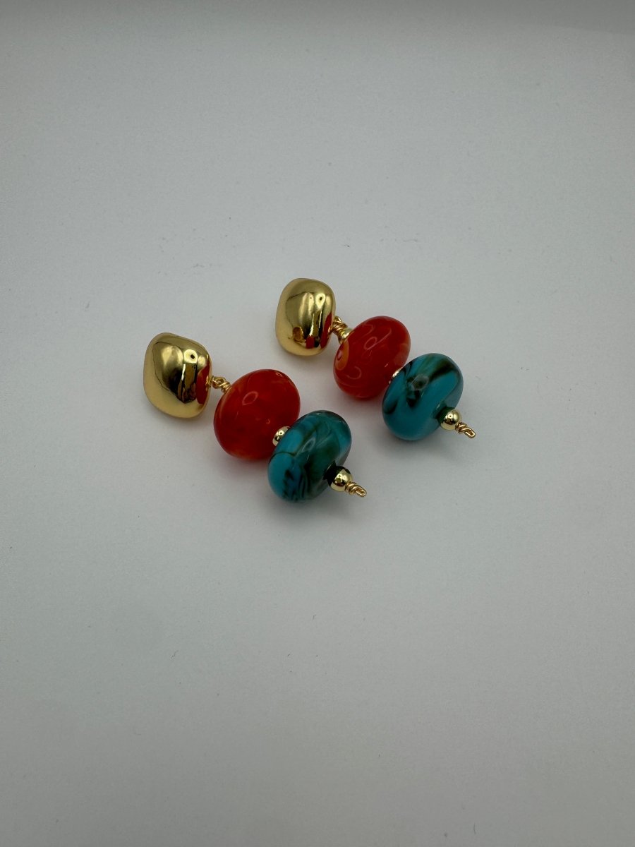 Current Mood Drop Earrings in Sunset — angled flat lay showing resin bead drops and gold-tone accents