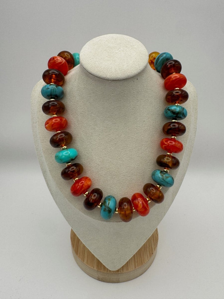 Current Mood Statement Necklace in Turquoise, Amber and Cognac — front view on necklace display