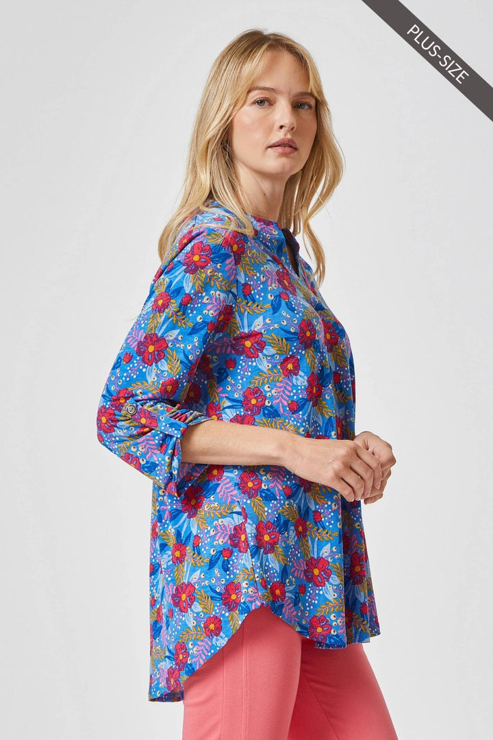 Side profile shot showing the 3/4 length sleeves with tab details and the slight high-low hemline.