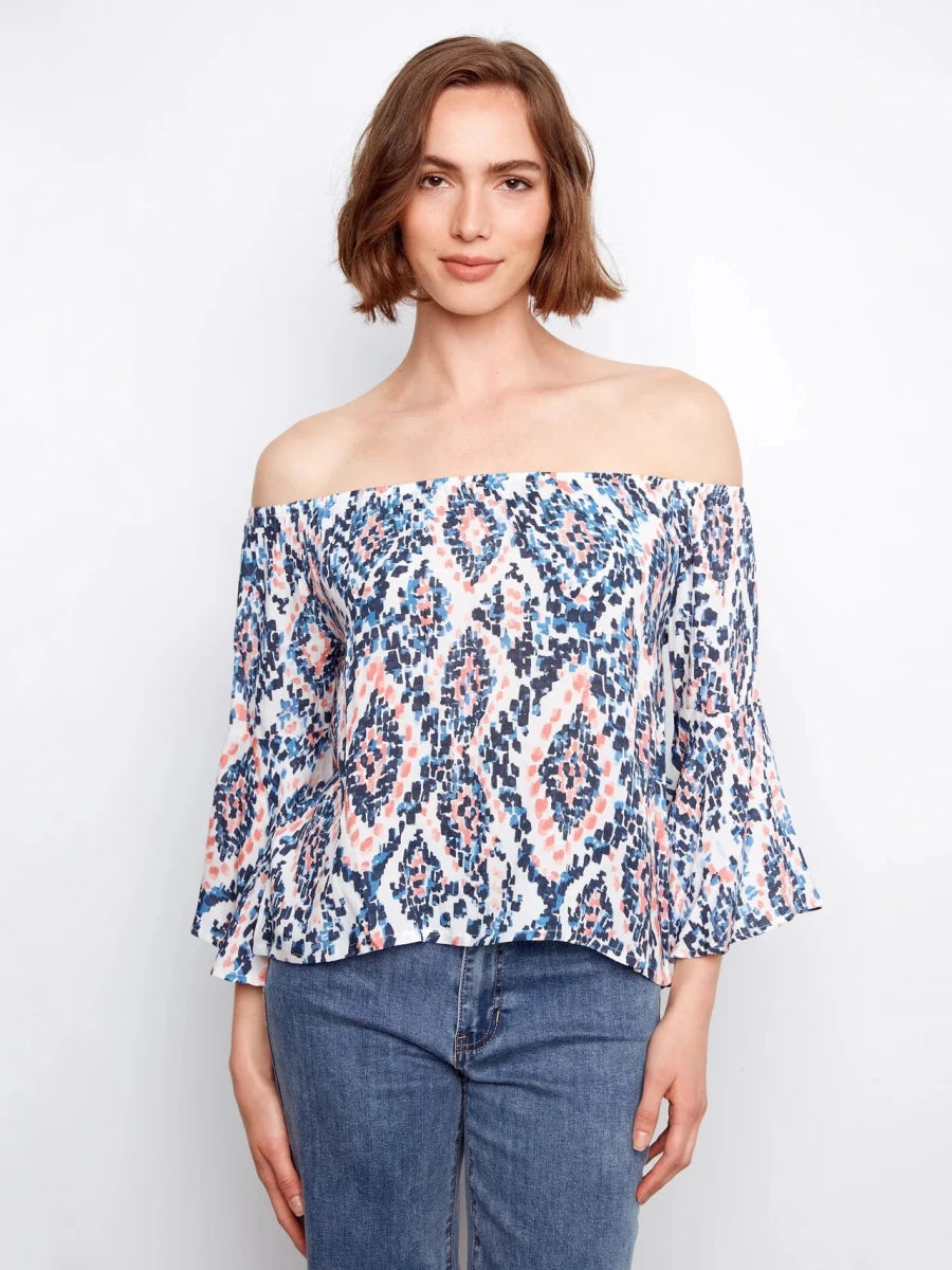 Charlie B Ikat Print Off-Shoulder Bell Sleeve Blouse in Nomad — front view on model, arms relaxed