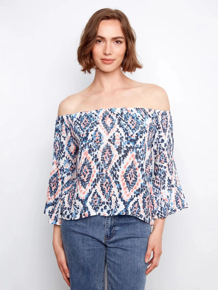 Charlie B Ikat Print Off-Shoulder Bell Sleeve Blouse in Nomad — front view on model, arms relaxed