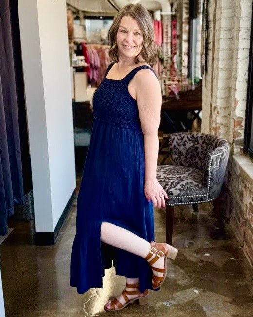 Dear John Chasity Crochet Cotton Midi Dress in Black Iris, tiered skirt and ruffle hem with cognac strappy sandals, lifestyle view on model
