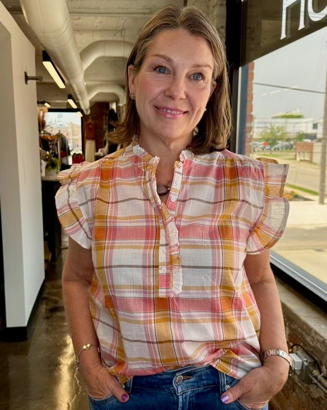 Dear John Denim Chatra Cotton Plaid Ruffle Top in Picnic Plaid, ruffle neckline and flutter sleeves styled with blue denim, three-quarter view on model