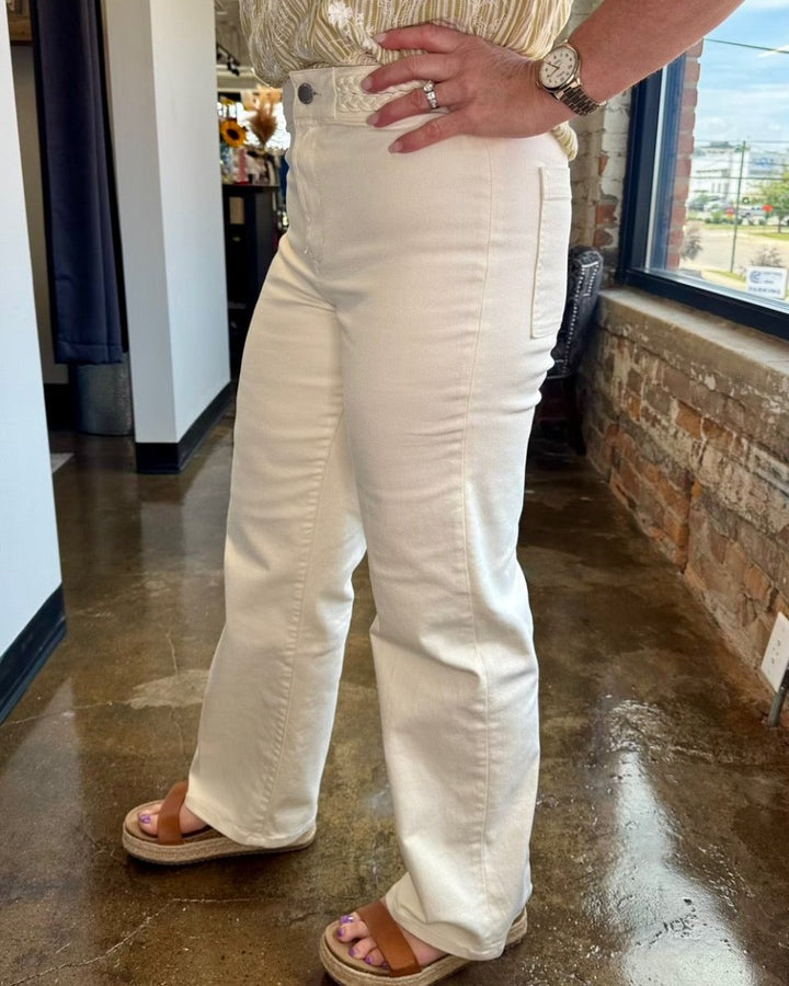 Dear John Denim Holly Straight Leg Pant in Wheat, embroidered high-rise waistband with silver button and side seam detail, side view on model
